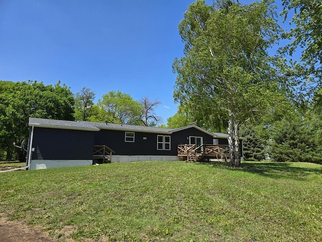68005 County Road 3, Bandon Twp, MN 55332 - rear view of property with a wooden deck and a yard