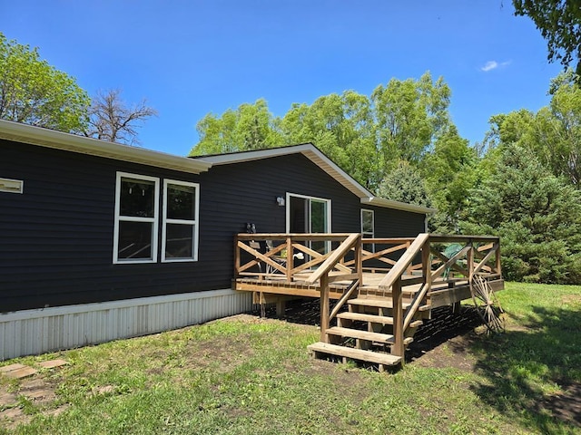 68005 County Road 3, Bandon Twp, MN 55332 - rear view of house featuring a deck and a lawn