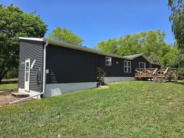 68005 County Road 3, Bandon Twp, MN 55332 - back of property with a lawn, a wooden deck, and entry steps
