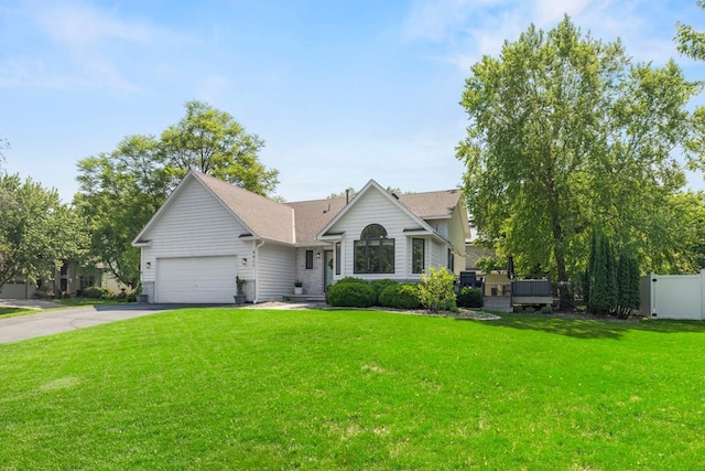 4417 Braddock Trl, Eagan, MN 55123 - view of front of property featuring driveway, an attached garage, and a shingled roof