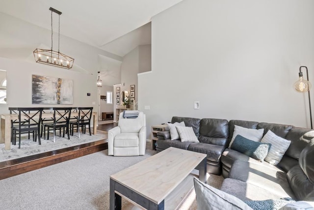 4417 Braddock Trl, Eagan, MN 55123 - living room with carpet, a chandelier, and high vaulted ceiling