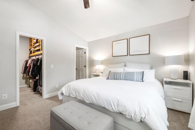 4417 Braddock Trl, Eagan, MN 55123 - carpeted bedroom featuring a walk in closet, vaulted ceiling, baseboards, a closet, and ceiling fan