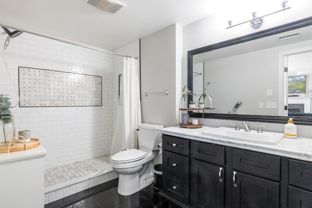 4417 Braddock Trl, Eagan, MN 55123 - bathroom featuring vanity, toilet, a tile shower, and tile patterned flooring