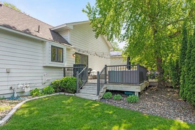 4417 Braddock Trl, Eagan, MN 55123 - rear view of property featuring a wooden deck, a yard, and a shingled roof