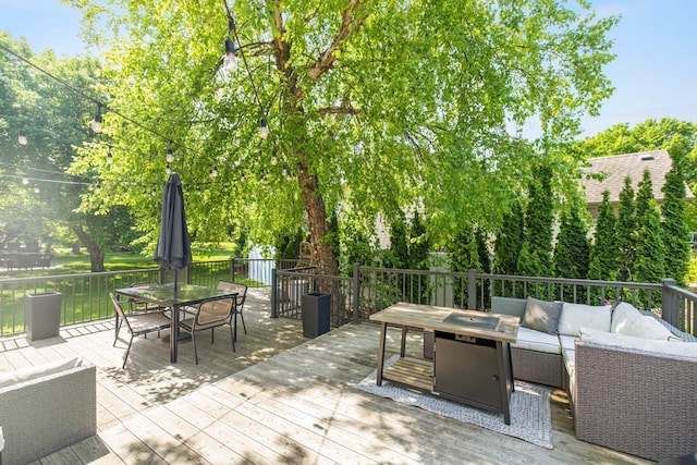 4417 Braddock Trl, Eagan, MN 55123 - deck featuring an outdoor living space with a fire pit and outdoor dining space