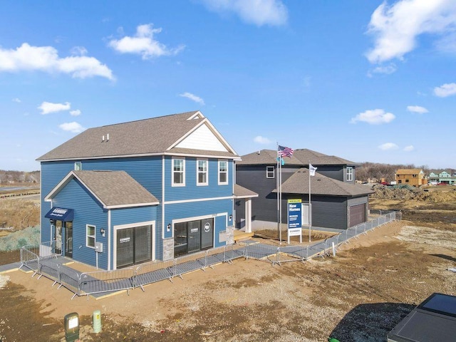 23548 Ashbury Dr, Rogers, MN 55374 - rear view of house featuring a shingled roof
