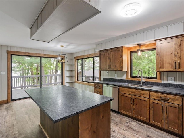 15622 Sand Beach Park, Bay Lake Twp, MN 56444 - kitchen with dishwasher, a sink, dark countertops, light wood-style flooring, and a kitchen island