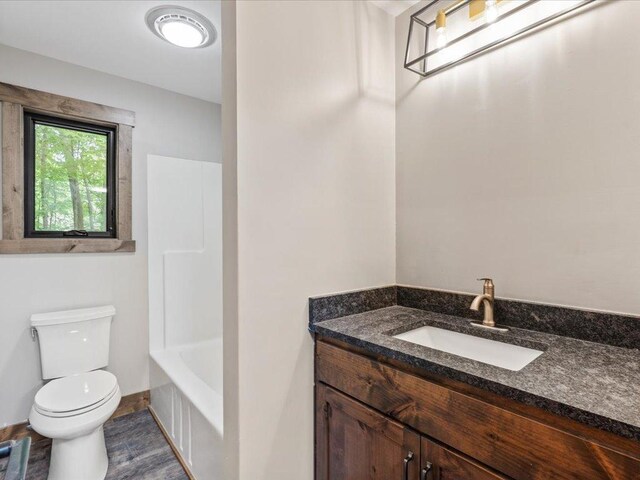 15622 Sand Beach Park, Bay Lake Twp, MN 56444 - full bath with toilet, vanity, and wood finished floors