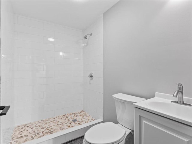 15622 Sand Beach Park, Bay Lake Twp, MN 56444 - bathroom featuring toilet, a tile shower, and vanity