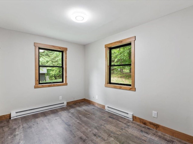 15622 Sand Beach Park, Bay Lake Twp, MN 56444 - empty room with a baseboard radiator, plenty of natural light, and baseboards