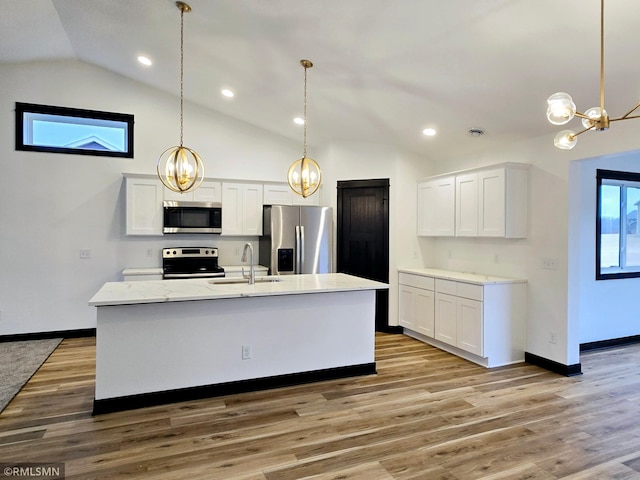 1109 9th Ave SE, Waseca, MN 56093 - kitchen featuring appliances with stainless steel finishes, a sink, a chandelier, lofted ceiling, and white cabinetry