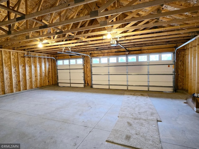 1109 9th Ave SE, Waseca, MN 56093 - garage featuring a garage door opener