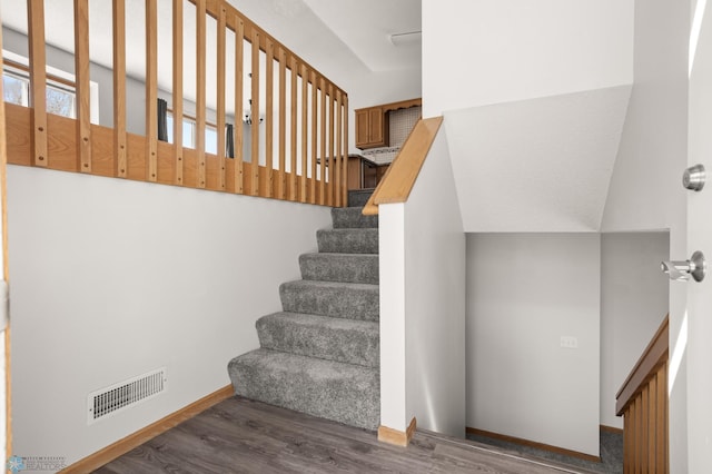 2831 Wheatland Dr S, Fargo, ND 58103 - stairs with wood finished floors and baseboards