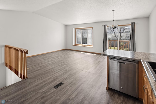 2831 Wheatland Dr S, Fargo, ND 58103 - kitchen with stainless steel dishwasher, a chandelier, dark wood finished floors, pendant lighting, and baseboards
