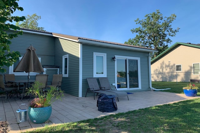 27096 Little Floyd Lake Rd Unit 1, Detroit Lakes, MN 56501 - rear view of property with a patio