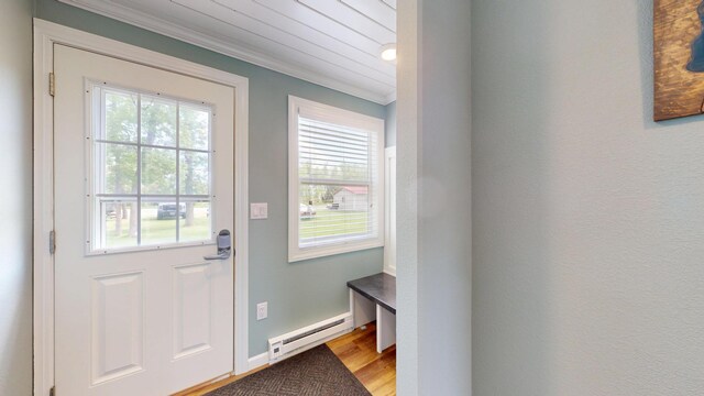 27096 Little Floyd Lake Rd Unit 1, Detroit Lakes, MN 56501 - doorway with a baseboard radiator, crown molding, and wood finished floors