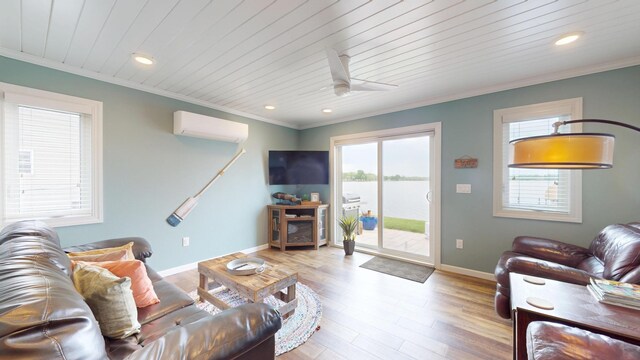 27096 Little Floyd Lake Rd Unit 1, Detroit Lakes, MN 56501 - living area with an AC wall unit, a ceiling fan, recessed lighting, crown molding, and wood finished floors