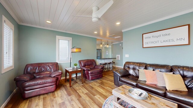 27096 Little Floyd Lake Rd Unit 1, Detroit Lakes, MN 56501 - living room with baseboards, wood finished floors, crown molding, recessed lighting, and a ceiling fan