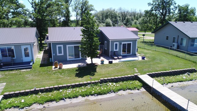 27096 Little Floyd Lake Rd Unit 1, Detroit Lakes, MN 56501 - back of house featuring a patio area and metal roof