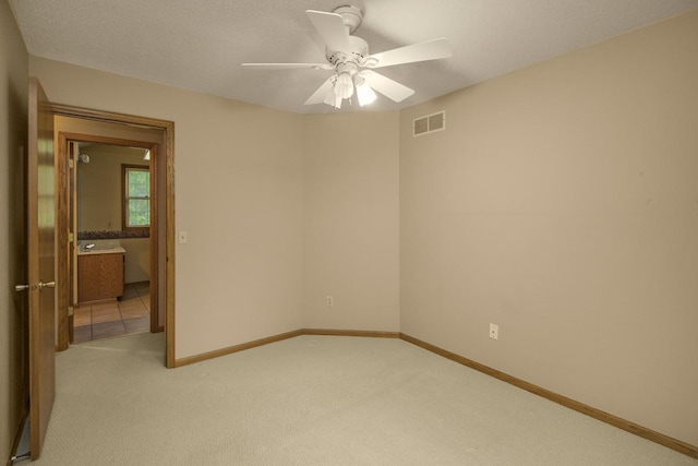 4906 Bayswater Rd, Minnetonka, MN 55345 - unfurnished room featuring light carpet, ceiling fan, and baseboards