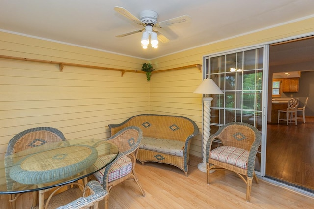 4906 Bayswater Rd, Minnetonka, MN 55345 - living area featuring wood finished floors, a ceiling fan, and wood walls