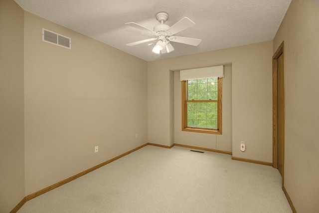 4906 Bayswater Rd, Minnetonka, MN 55345 - empty room featuring light colored carpet, ceiling fan, and a textured ceiling