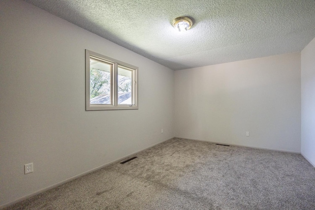 1605 4th St SW, Austin, MN 55912 - carpeted spare room featuring a textured ceiling