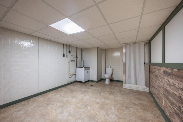 1605 4th St SW, Austin, MN 55912 - finished below grade area with carpet flooring and a paneled ceiling