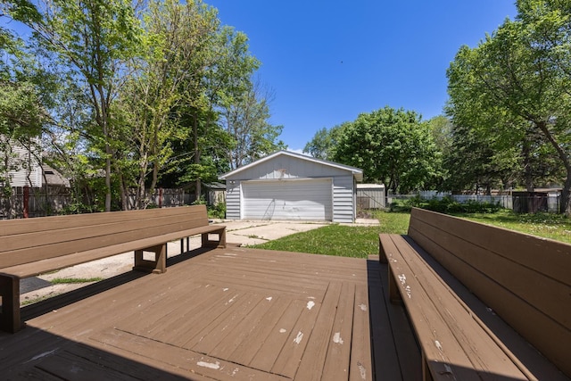 1605 4th St SW, Austin, MN 55912 - wooden terrace with an outdoor structure, a detached garage, and a fenced backyard