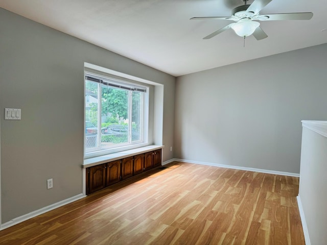 98 Magnolia Ave W, Saint Paul, MN 55117 - unfurnished room featuring light wood-type flooring, baseboards, and ceiling fan
