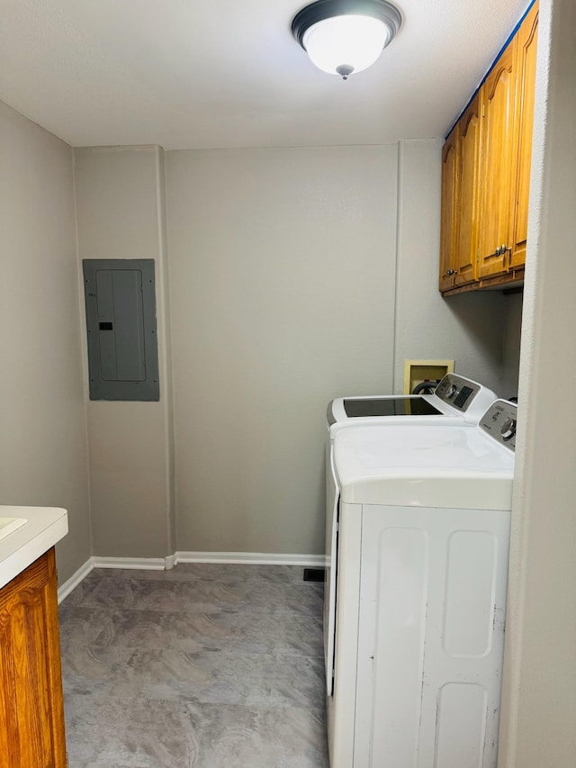 98 Magnolia Ave W, Saint Paul, MN 55117 - laundry area featuring electric panel, cabinet space, washer and clothes dryer, light colored carpet, and baseboards