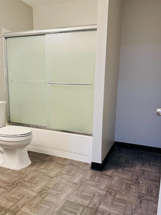 98 Magnolia Ave W, Saint Paul, MN 55117 - bathroom featuring toilet and combined bath / shower with glass door