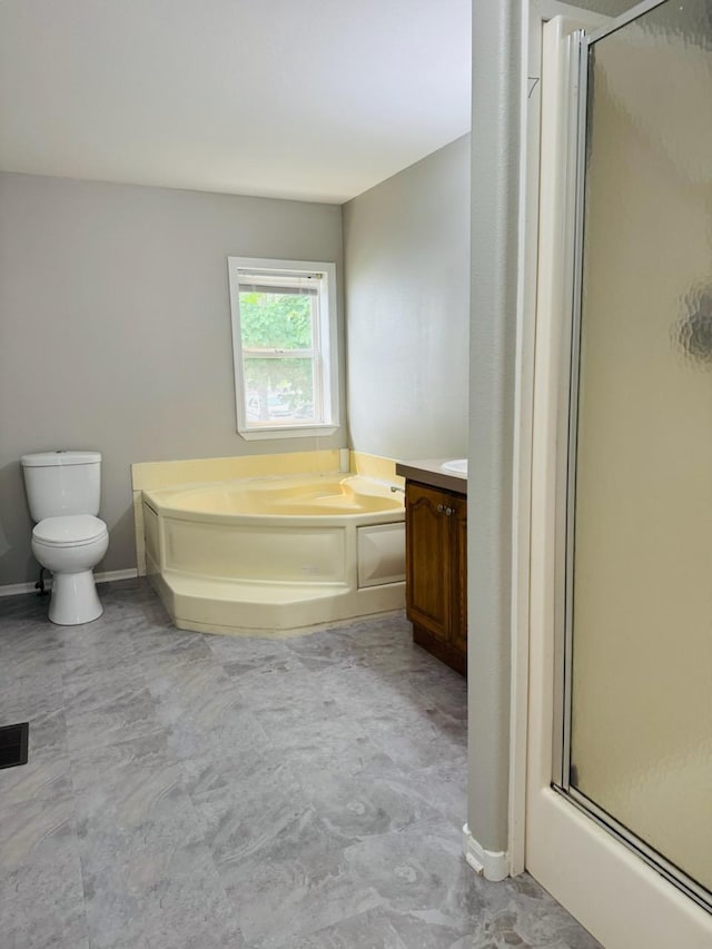 98 Magnolia Ave W, Saint Paul, MN 55117 - full bath with a shower stall, a bath, toilet, vanity, and baseboards