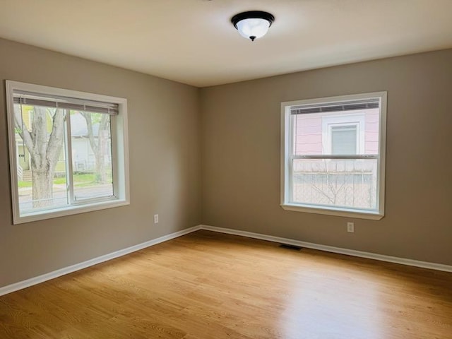 98 Magnolia Ave W, Saint Paul, MN 55117 - empty room featuring light wood-type flooring and baseboards