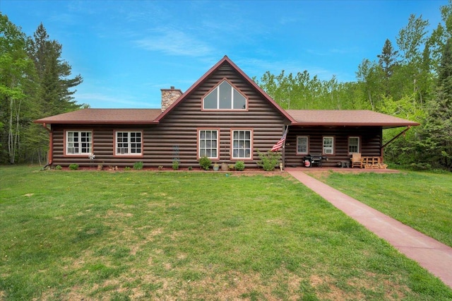 4985 Sam Anderson Rd, Amnicon Twp, WI 54874 - log home featuring a chimney and a front yard