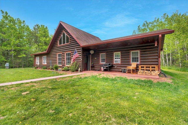 4985 Sam Anderson Rd, Amnicon Twp, WI 54874 - rear view of house featuring a lawn and log siding