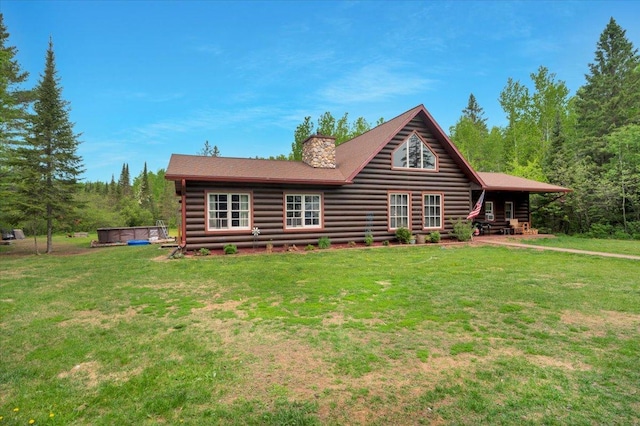 4985 Sam Anderson Rd, Amnicon Twp, WI 54874 - view of front of home featuring a chimney, a front yard, and log siding