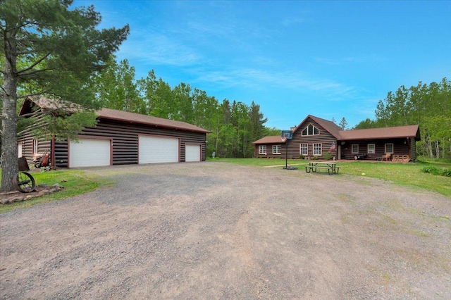 4985 Sam Anderson Rd, Amnicon Twp, WI 54874 - view of front of house featuring a garage and an outbuilding