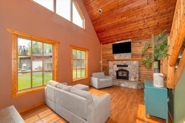 4985 Sam Anderson Rd, Amnicon Twp, WI 54874 - living area with healthy amount of natural light, high vaulted ceiling, a fireplace, light wood-style flooring, and wood ceiling