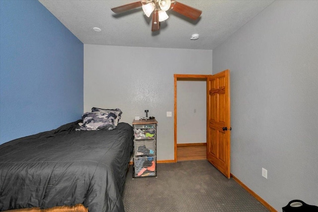 4985 Sam Anderson Rd, Amnicon Twp, WI 54874 - bedroom featuring carpet flooring, a ceiling fan, and baseboards