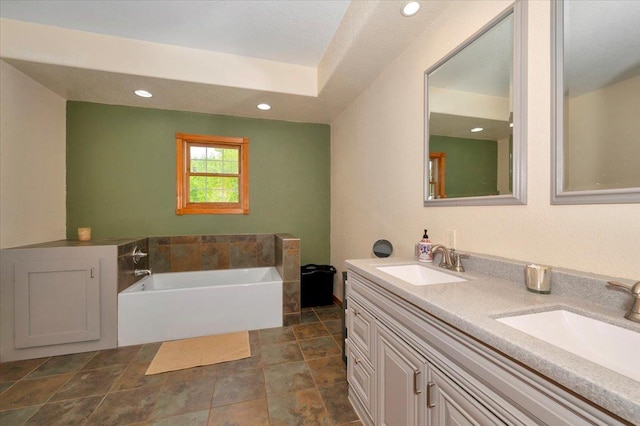 4985 Sam Anderson Rd, Amnicon Twp, WI 54874 - full bathroom with a garden tub, double vanity, and recessed lighting
