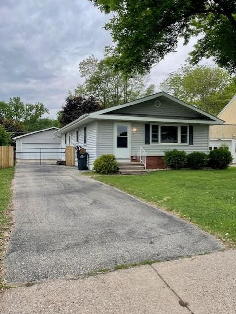 4155 7th St, Goodview, MN 55987 - bungalow-style house featuring a garage, entry steps, and an outdoor structure