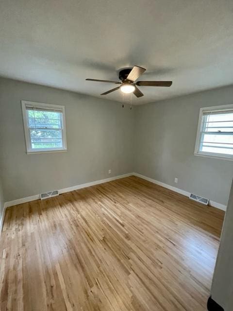 4155 7th St, Goodview, MN 55987 - unfurnished room featuring wood finished floors, ceiling fan, and baseboards