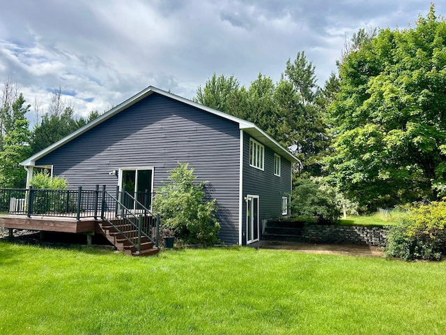 22225 Washington St NE, East Bethel, MN 55011 - view of side of home with a deck, a yard, and stairs