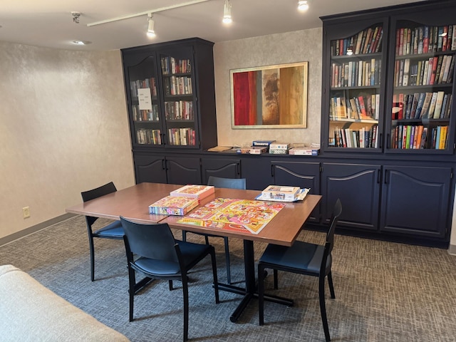 1181 Edgcumbe Rd Unit 213, Saint Paul, MN 55105 - dining room with track lighting, dark colored carpet, and a textured wall