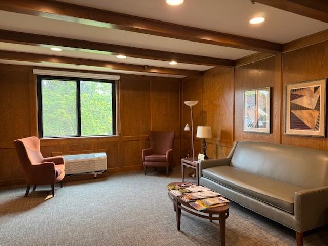1181 Edgcumbe Rd Unit 213, Saint Paul, MN 55105 - living area featuring carpet, beamed ceiling, recessed lighting, and wood walls