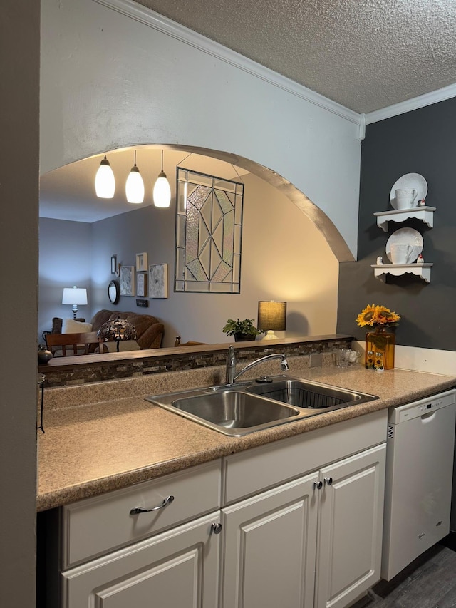 1181 Edgcumbe Rd Unit 213, Saint Paul, MN 55105 - kitchen with stainless steel dishwasher, a sink, ornamental molding, white cabinetry, and a textured ceiling