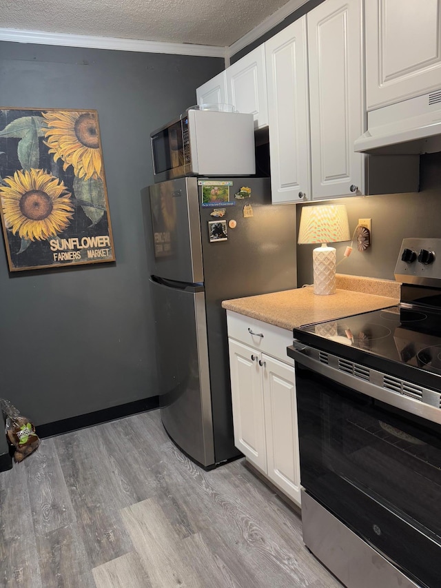 1181 Edgcumbe Rd Unit 213, Saint Paul, MN 55105 - kitchen featuring appliances with stainless steel finishes, extractor fan, light wood-style flooring, a textured ceiling, and white cabinetry