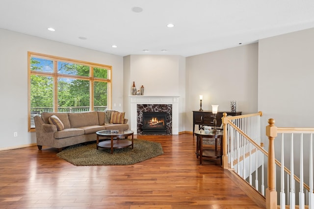 6654 Orchid Ln N, Maple Grove, MN 55311 - living area featuring wood finished floors, a premium fireplace, recessed lighting, and baseboards