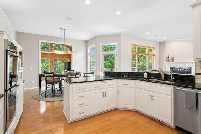 6654 Orchid Ln N, Maple Grove, MN 55311 - kitchen featuring stainless steel appliances, a sink, light wood-style flooring, plenty of natural light, and recessed lighting